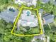Aerial view of the property highlighting the house, in-ground pool, and lush landscaping at 940 Lincoln Cir, Winter Park, FL 32789