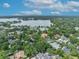 Panoramic aerial shot capturing the neighborhood's layout, landscaping, and nearby lake at 940 Lincoln Cir, Winter Park, FL 32789