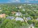 Overhead image of a residential neighborhood featuring lush greenery and beautiful homes with swimming pools at 940 Lincoln Cir, Winter Park, FL 32789