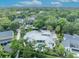 Stunning aerial view of a luxurious home with a private pool and well-manicured landscaping at 940 Lincoln Cir, Winter Park, FL 32789