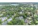 Scenic aerial shot of the neighborhood showcasing lush greenery and well-maintained homes at 940 Lincoln Cir, Winter Park, FL 32789