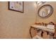 Elegant powder room featuring a unique vanity and decorative mirror at 940 Lincoln Cir, Winter Park, FL 32789