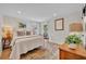 Serene bedroom featuring neutral tones, natural light, and hardwood floors at 940 Lincoln Cir, Winter Park, FL 32789