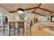 Dining room featuring a chandelier, wood plank ceiling, and a light wood table at 940 Lincoln Cir, Winter Park, FL 32789