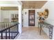 Inviting front entryway featuring a decorative door, travertine floors and beautiful decor at 940 Lincoln Cir, Winter Park, FL 32789