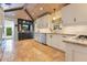 Bright kitchen with white cabinets, stainless appliances and tiled floors at 940 Lincoln Cir, Winter Park, FL 32789
