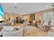 Cozy living room with lots of seating, a fireplace, and lots of natural light at 940 Lincoln Cir, Winter Park, FL 32789