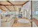 Bright, open-concept home featuring wood floors, beamed ceilings, and elegant decor at 940 Lincoln Cir, Winter Park, FL 32789
