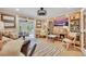 Elegant living room boasting hardwood floors, eclectic decor, and cozy seating arrangement at 940 Lincoln Cir, Winter Park, FL 32789