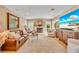 Cozy living room with lots of seating, a fireplace, a large flatscreen TV and lots of natural light at 940 Lincoln Cir, Winter Park, FL 32789
