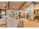 Spacious living room with wood beam ceiling, fireplace and lots of natural light at 940 Lincoln Cir, Winter Park, FL 32789