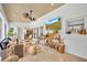 Bright and airy living room with tiled floors, white walls, and neutral-toned furnishings at 940 Lincoln Cir, Winter Park, FL 32789