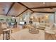 Open living space featuring a gorgeous beamed ceiling, hardwood floors and lots of natural light at 940 Lincoln Cir, Winter Park, FL 32789