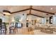 Open living space featuring a gorgeous beamed ceiling, hardwood floors and lots of natural light at 940 Lincoln Cir, Winter Park, FL 32789