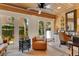 Bright home office space with natural light and view of the outdoor garden at 940 Lincoln Cir, Winter Park, FL 32789