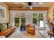 Bright office space with access to the backyard, featuring natural light and neutral decor at 940 Lincoln Cir, Winter Park, FL 32789