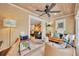 Cozy office featuring wood accents, comfortable seating, and seamless transition to the living room at 940 Lincoln Cir, Winter Park, FL 32789