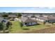 Aerial perspective showcasing the property, surrounding homes, landscaping, and overall neighborhood at 1119 Union Ave, Mascotte, FL 34753