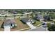 Aerial view of homes in a residential area with well-manicured lawns and established landscaping at 1119 Union Ave, Mascotte, FL 34753