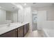 Bright bathroom with double vanity, ample counter space, and modern fixtures at 1119 Union Ave, Mascotte, FL 34753