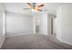 Spacious bedroom with carpeted floor and ceiling fan at 1119 Union Ave, Mascotte, FL 34753