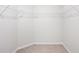 Walk-in closet with wire shelving and carpeted floor at 1119 Union Ave, Mascotte, FL 34753