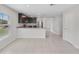Open concept kitchen with granite countertops and stainless steel appliances at 1119 Union Ave, Mascotte, FL 34753