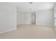 Spacious open living area with neutral walls, tile floors, and recessed lighting at 1119 Union Ave, Mascotte, FL 34753