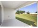 This covered patio offers a view of the backyard and a space for outdoor relaxation at 1119 Union Ave, Mascotte, FL 34753