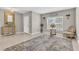 Light-filled foyer featuring neutral walls, decorative mirror, console table and tiled flooring at 116 Green Branch Blvd, Groveland, FL 34736