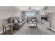 Cozy living room showcasing comfortable sofas, modern décor, and ample natural light at 116 Green Branch Blvd, Groveland, FL 34736