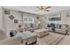 Comfortable living room featuring plush sofas, decorative lamps, and neutral décor at 116 Green Branch Blvd, Groveland, FL 34736
