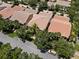 Aerial view of a home with mature trees, landscaped lawn, and a well-maintained street at 11918 Nautica Dr, Orlando, FL 32827