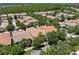 An aerial view of a residential neighborhood featuring well-maintained homes and mature trees at 11918 Nautica Dr, Orlando, FL 32827