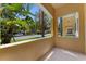 View from balcony looking out to the street featuring mature landscaping and a well-maintained exterior at 11918 Nautica Dr, Orlando, FL 32827