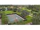 Basketball court is surrounded by lush landscaping, offering a private and enjoyable recreational space at 11918 Nautica Dr, Orlando, FL 32827