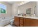 Bathroom featuring double sink vanity, large mirror and a shower-tub combo at 11918 Nautica Dr, Orlando, FL 32827