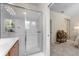 Bright bathroom featuring a glass shower with tile surround and vanity with a granite countertop at 11918 Nautica Dr, Orlando, FL 32827