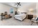Bedroom with neutral walls, carpet, and a ceiling fan with a window providing natural light at 11918 Nautica Dr, Orlando, FL 32827