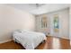 Bedroom with hardwood floors, ceiling fan, access to the outside through a sliding glass door at 11918 Nautica Dr, Orlando, FL 32827