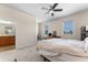 Bedroom with a workspace, large windows, and ensuite bathroom access offers comfort and convenience at 11918 Nautica Dr, Orlando, FL 32827