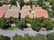 A beautiful two-story home with manicured lawn and vibrant tropical landscaping at 11918 Nautica Dr, Orlando, FL 32827