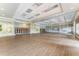 Hall with wood flooring, neutral walls, and folding chairs stacked neatly at 11918 Nautica Dr, Orlando, FL 32827