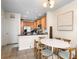 Bright kitchen area with stainless steel appliances, modern lighting, and round dining table with four chairs at 11918 Nautica Dr, Orlando, FL 32827