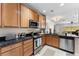 Updated kitchen with black granite countertops, light wood cabinets, and stainless steel appliances at 11918 Nautica Dr, Orlando, FL 32827