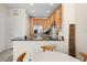 Bright kitchen features stainless steel appliances, and a bar overlooking the dining area at 11918 Nautica Dr, Orlando, FL 32827