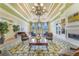 Inviting lounge area featuring elegant furnishings, chandelier, and bright, natural light at 11918 Nautica Dr, Orlando, FL 32827