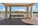 Pavilion with lake view offers serene place for relaxation with benches, columns and brick flooring at 11918 Nautica Dr, Orlando, FL 32827