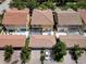 Aerial view of home with screened patio and landscaped backyard at 11918 Nautica Dr, Orlando, FL 32827