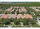 Aerial view of home with screened patio and landscaped backyard at 11918 Nautica Dr, Orlando, FL 32827